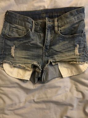 SO High-Rise Distressed Jean Shorties in Light Blue